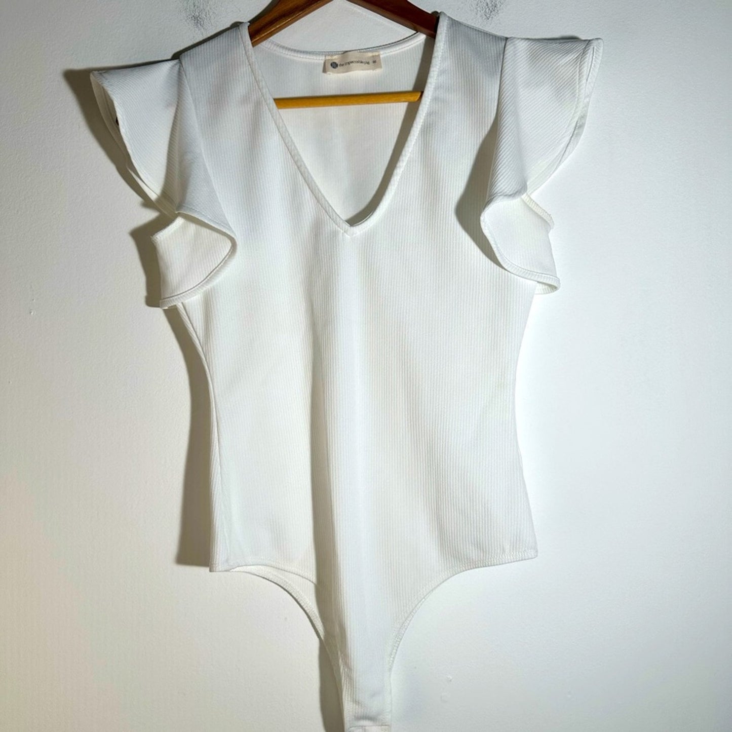 The Impeccable Pig White Bodysuit