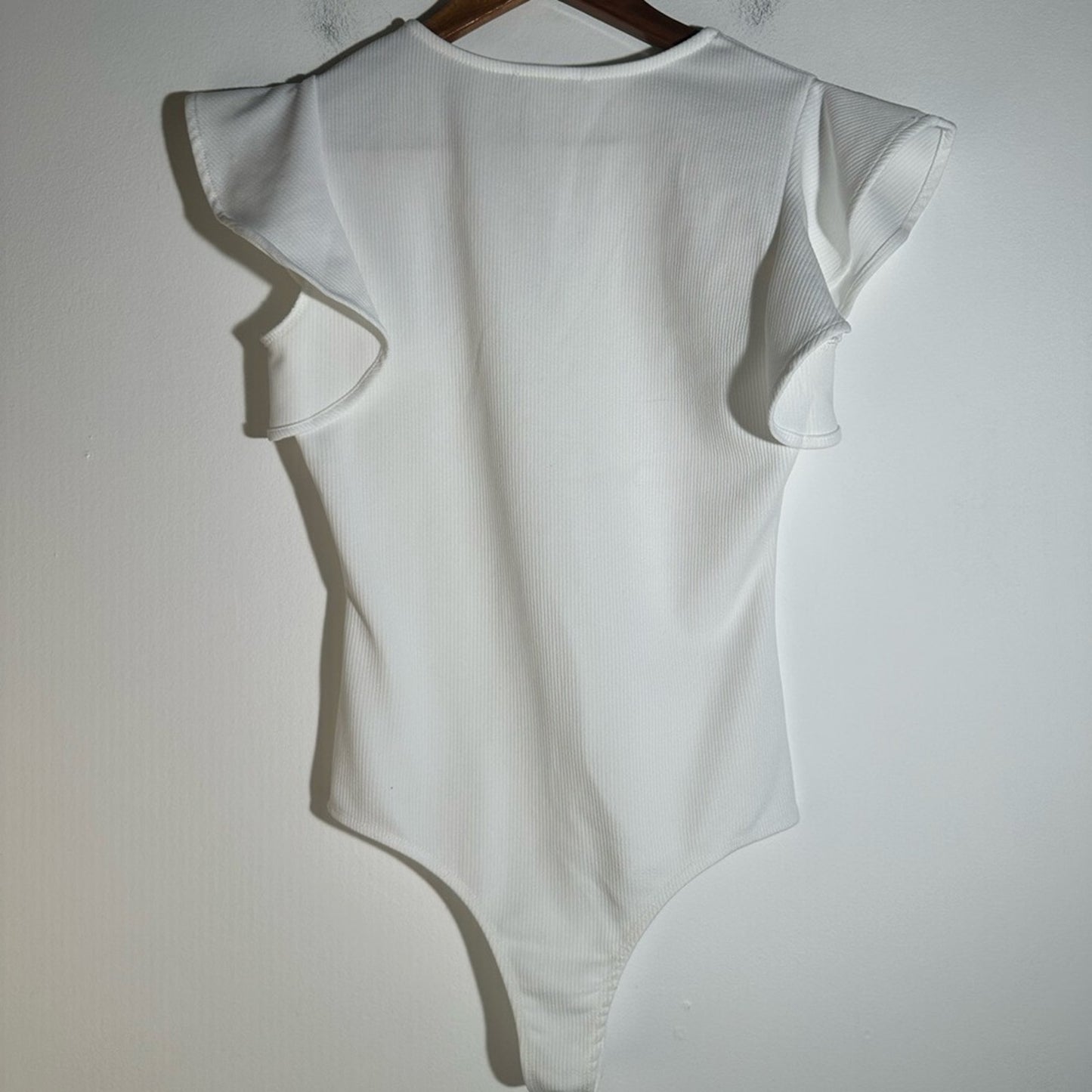 The Impeccable Pig White Bodysuit